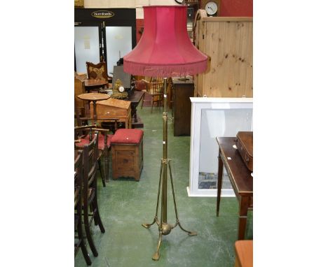 A telescopic brass standard lamp.