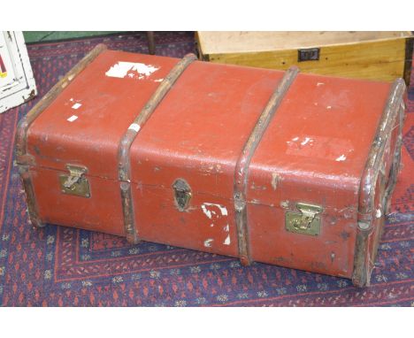 A wood bound travel trunk