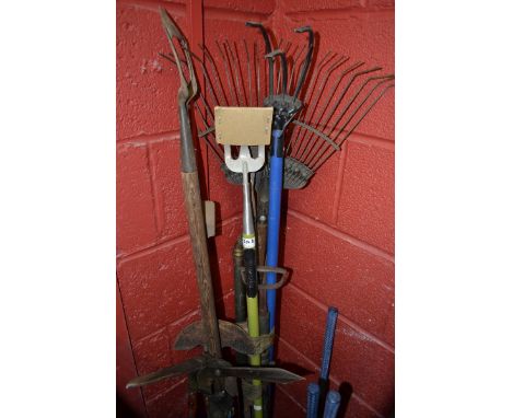 Garden tools-a bill hook, rake, hoe stirrup pump, etc