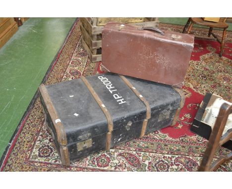 A large travelling trunk inscribed H. P. Troop with liner;  a suitcase (2) 