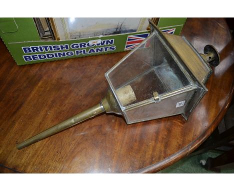 An early 20th century brass lamp converted for electricity.