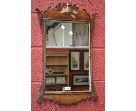 A mahogany Vauxhall mirror, pieced pediment with gilt eagle decoration, Glass 46.5cm x 30cm.
