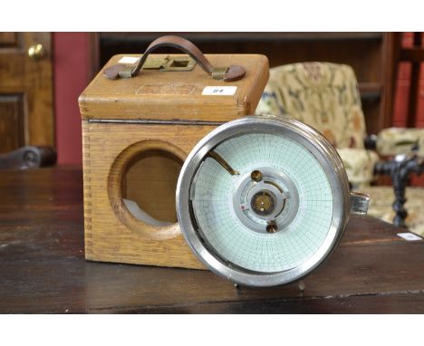 An oak cased Automatic Timing Clock Company pigeon clock