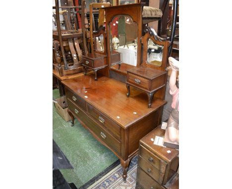 An Edwardian mahogany dressing table, triptych mirrors and two small drawers to top, two short drawers over one long,pierced 