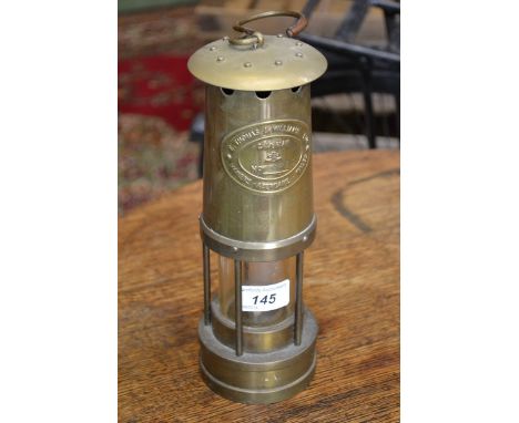 A Cambrian brass miners lamp, E Thomas and Williams