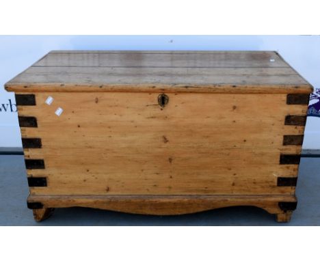 Pine and metal bound trunk .  