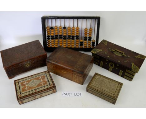 Two shelves of boxes including stationery box, ornamental trinket boxes, puzzle box and abacus.  