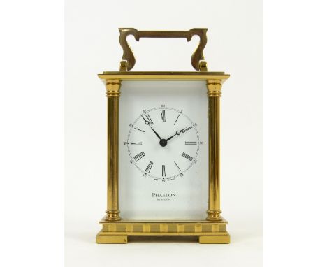 A Phaeton by Acctim brass and glass cased carriage clock, with key..  