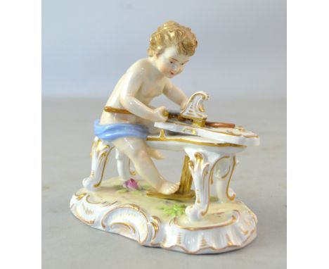 Potschappel figurine of a boy carving a bow, swathed in blue cloth, marked to base for Carl Thieme.  