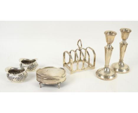 Pair of silver candlesticks, toast rack, trinket box and a pair of salts,.  