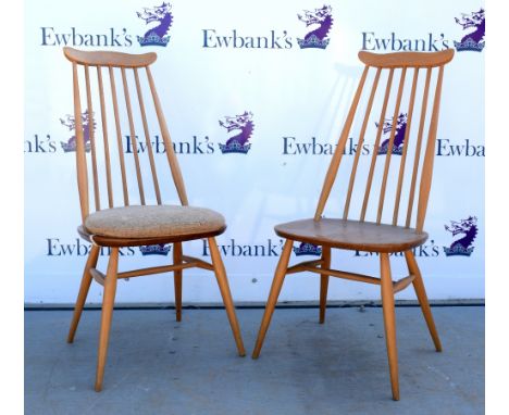 Set of eight light elm Ercol rail back dining chairs .  