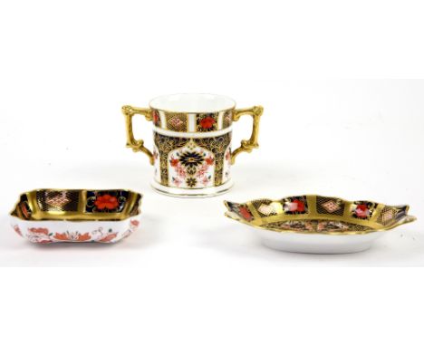 A Royal Crown Derby 1128 Imari pattern loving cup and two pin dishes. (3).  