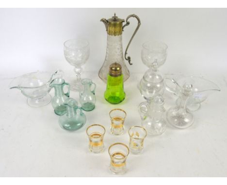 Shelf of glassware including decanters, wine glasses, candlesticks, pair of white metal candlesticks.  