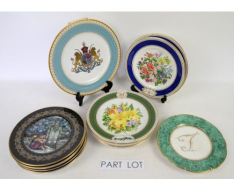 Shelf of collectors plates including some blue and white .  