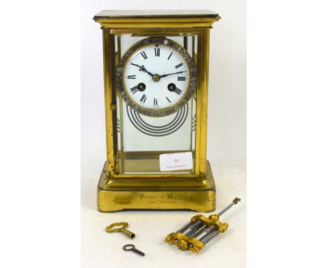 Brass four glass striking mantel clock.  