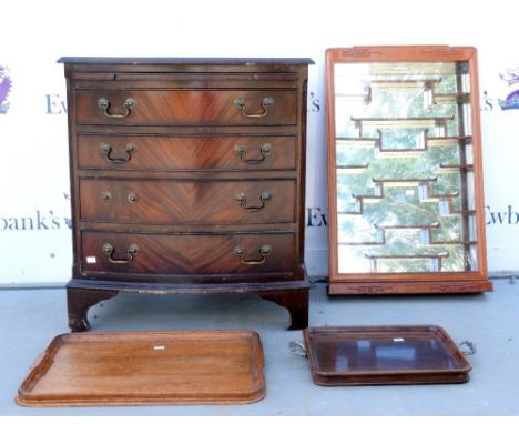 Mahogany bow fronted chest, two trays and  a wall hanging cupboard .  