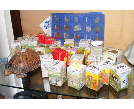 A collection of approx. 25 assorted Wade Whimsies - boxed, sundry coins, etc. 