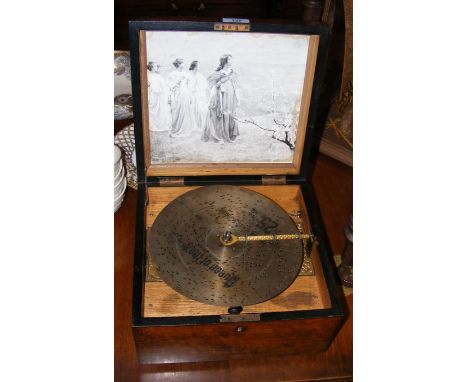 Victorian polyphon with walnut case and a selection of 9" discs 
