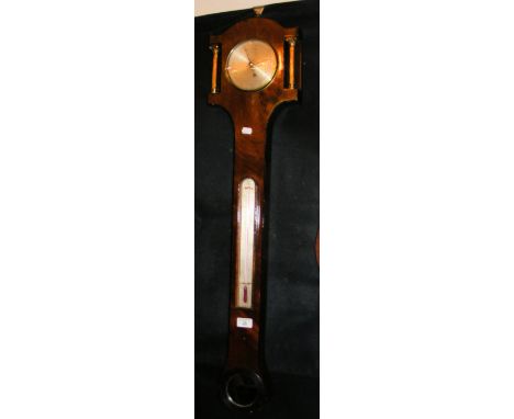 A mahogany stick barometer with circular silvered dial to the top and thermometer below - 94cm 