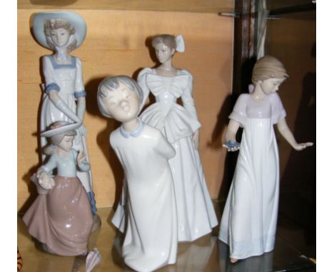 Five assorted Nao figurines 