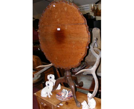 A mahogany snap-top tripod table 