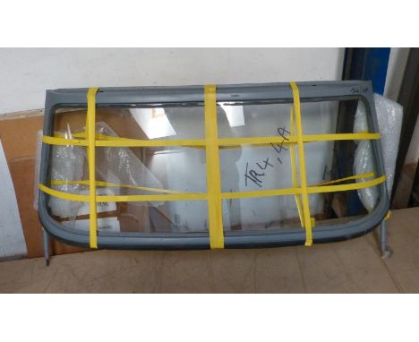 A TR4/4A (1961 - 1967) windscreen frame with glass, in grey primer.