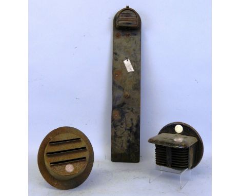 A Vintage car number plate holder with light fitting attached, together with two WWII period headlamp shields (3).