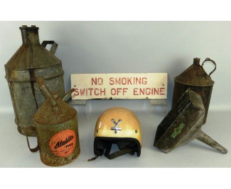 Three conical oil cans, a rectangular fuel funnel, a Centurion crash helmet and an enamel sign (5).