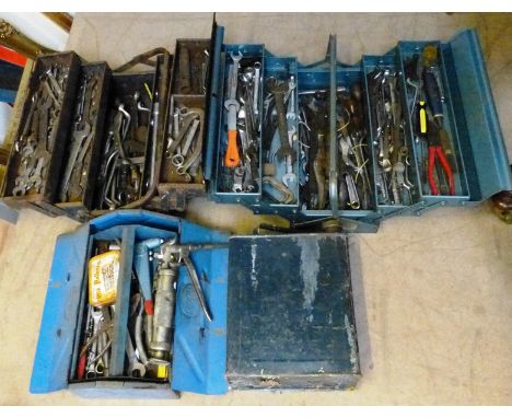 A vintage petrol can and three metal tool boxes, containing a variety of automotive tools