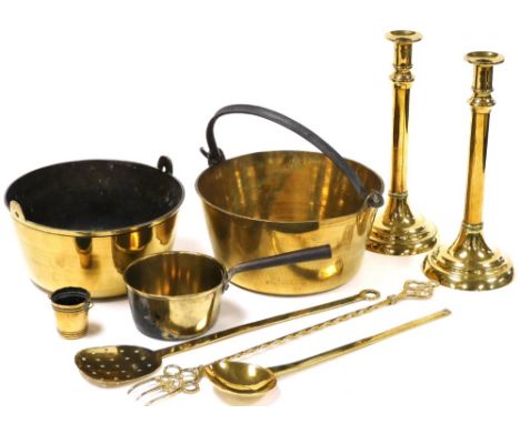 A group of brassware, to include brass jam pan, 26cm diameter, a pair of brass candlesticks, 31cm high, toasting fork, etc. 