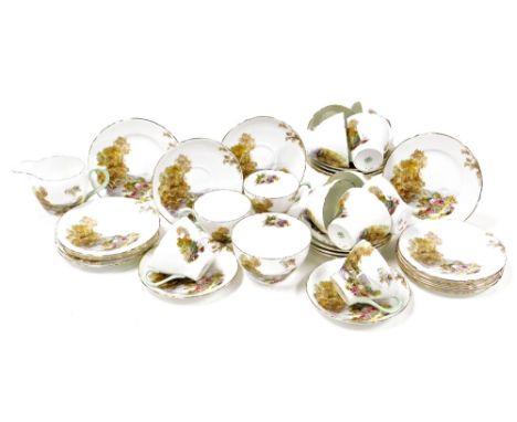 A Shelley porcelain Heather pattern part tea service, comprising twelve teacups, twelve saucers, six cake plates, sugar bowl 