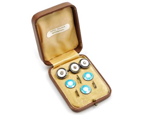 A cased set of silver and enamel collar studs, comprising three blue and white enamel collar studs, and another set of three 