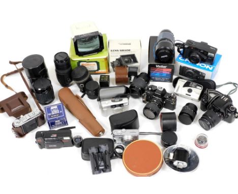 A group of camera related equipment, to include a Canon EOS 1000F camera, a Praktica B100 camera, a Kodak Retina IA, with var