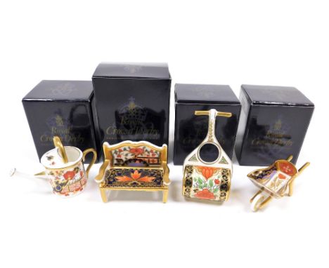 Four Royal Crown Derby porcelain miniature items, comprising Water Garden wheelbarrow, 11cm wide, Lotus Blossom garden roller