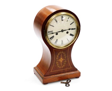 An Edwardian mahogany and boxwood inlaid balloon mantel clock, the cream enamel dial bearing Roman numerals, eight day moveme