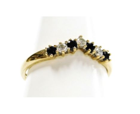 A 9ct gold and cz wishbone ring, set with cz and blue paste stones in claw setting, ring size R, 1.7g all in. 