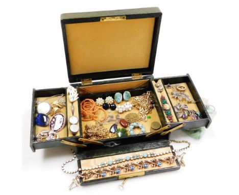 A green material cantilevered jewellery box and contents, including clip on earrings, dress jewellery, coral necklace, filigr