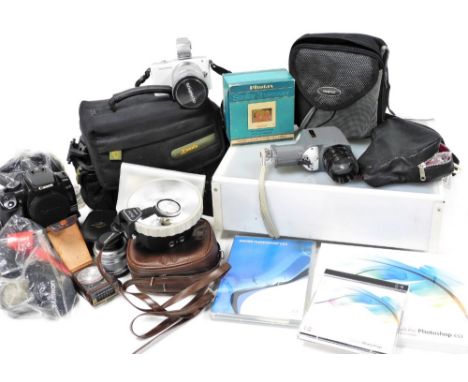Various photographic equipment, to include an Olympus pen mini E-PMI camera, a light box, Canon 400D and battery grip, a Soli