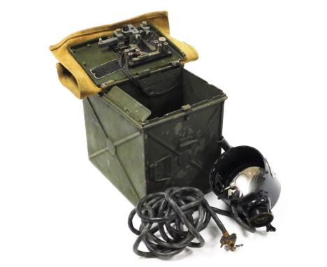 A World War II signal lamp, contained in a green metal case with canvas lid, the case 22cm high. 