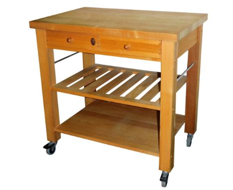 A Servus light oak butcher's block, with two frieze drawers, above a slatted shelf over a further solid shelf, on castors, 90