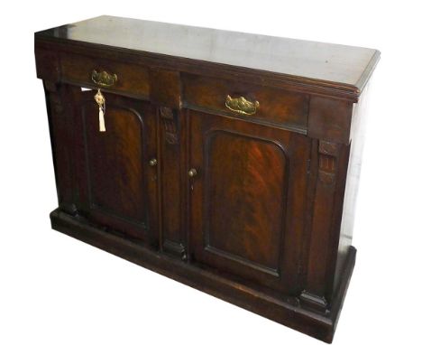 A Victorian mahogany chiffonier, with two drawers above a pair of panel doors, raised on a plinth base, 87cm high, 117cm wide