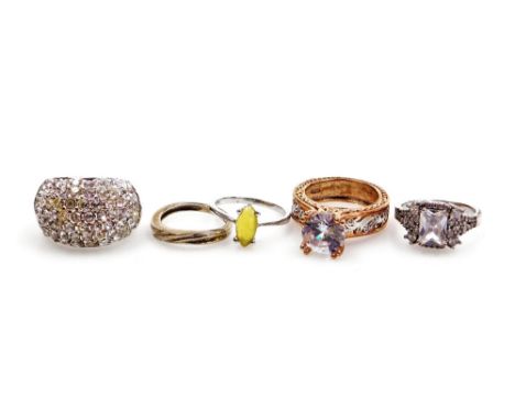 Five various dress rings, comprising an imitation diamond and amethyst set cluster ring, imitation opal ring, wedding band, g