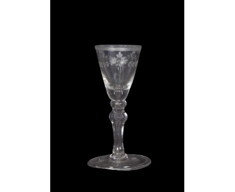 Georgian wine glass with swag engraving to the fluted bowl and triple knop above a clear stem, 14cm high