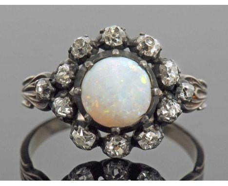 Opal and diamond cluster ring, the round cut cabochon opal multi claw set within an old cut diamond surround, diamond ct wgt 