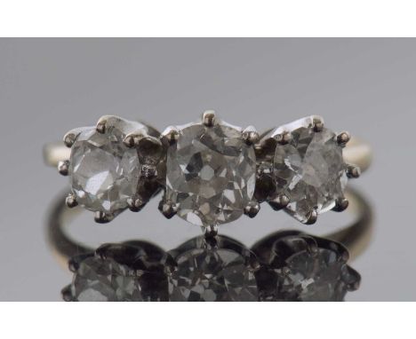 Three stone diamond ring featuring three graduated old cut diamonds, 0.90ct approx, size K