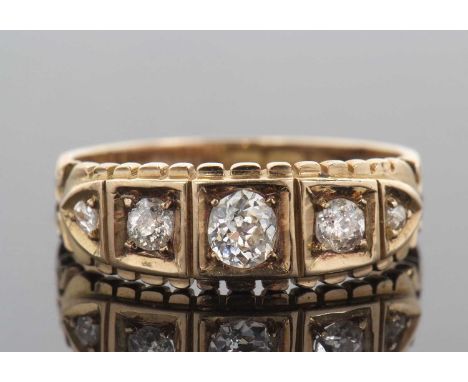 Victorian five stone diamond ring featuring five graduated old brilliant cut diamonds each in a carved box setting, diamond c