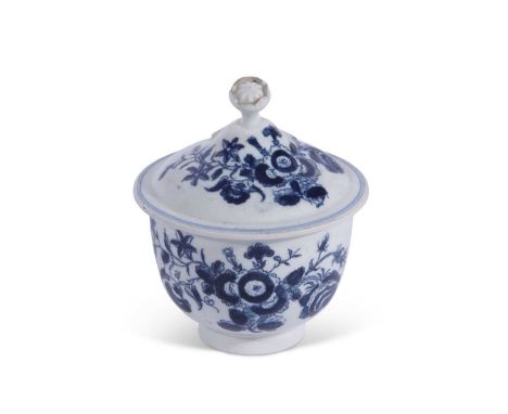 A Lowestoft porcelain sucrier and cover of unusual small size printed in blue with a version of the three flowers pattern10cm