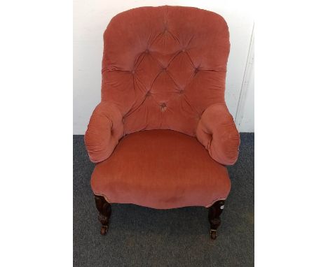 A 19th Century spoonback chair, pink button-backed upholstery, front cabriole supports and castors