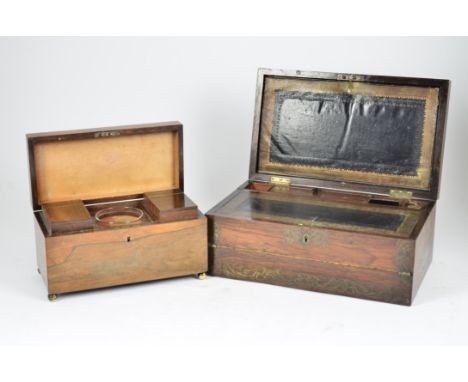 A rosewood tea caddy, two canisters and glass mixing bowl, brass bun feet, 31 cm wide; together with a mahogany and brass inl