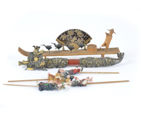 A collection of early 20th Century Japanese works of art, including opium pipe mounted with floral brass decoration, stands m